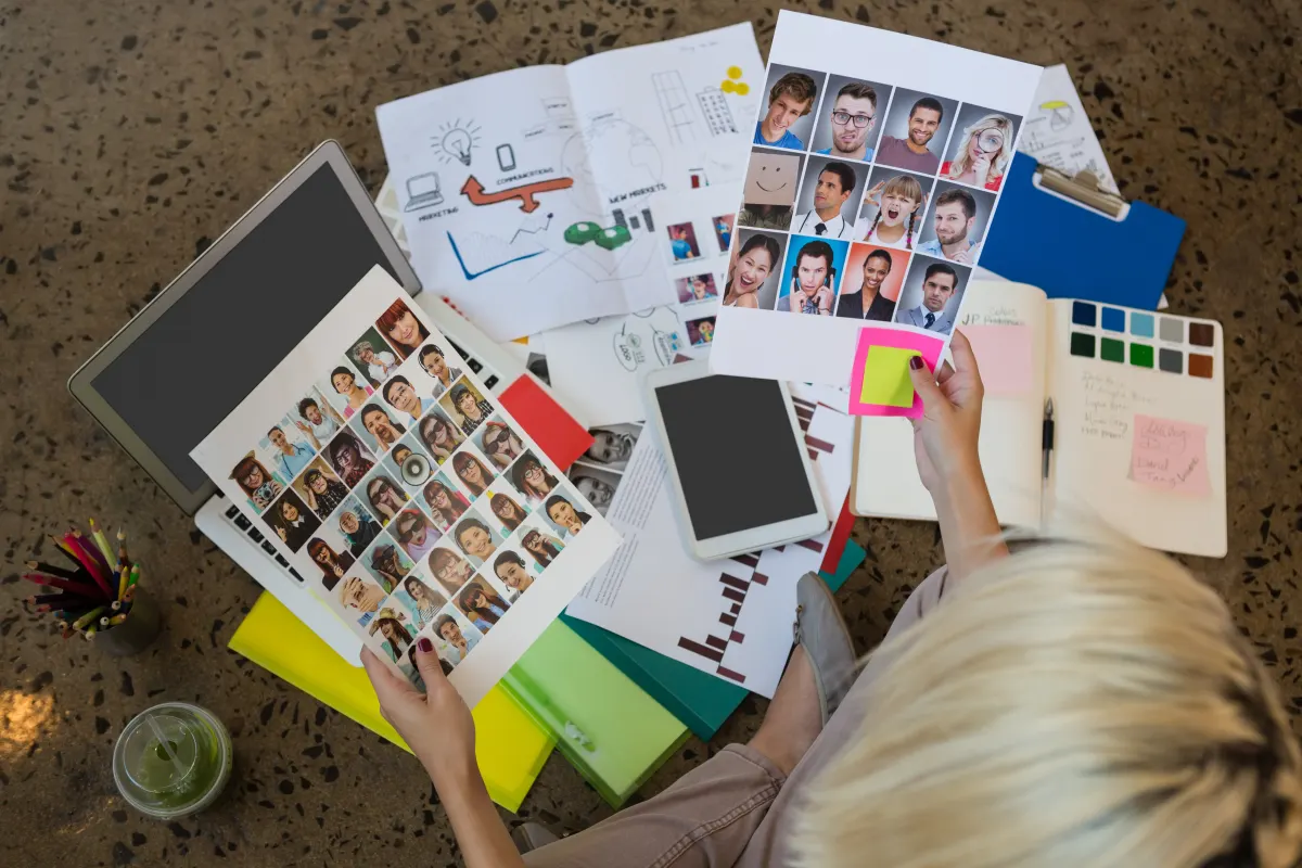 Businesswoman-holding-documents-sitting-on-floor-a-2023-11-27-05-36-56-utc