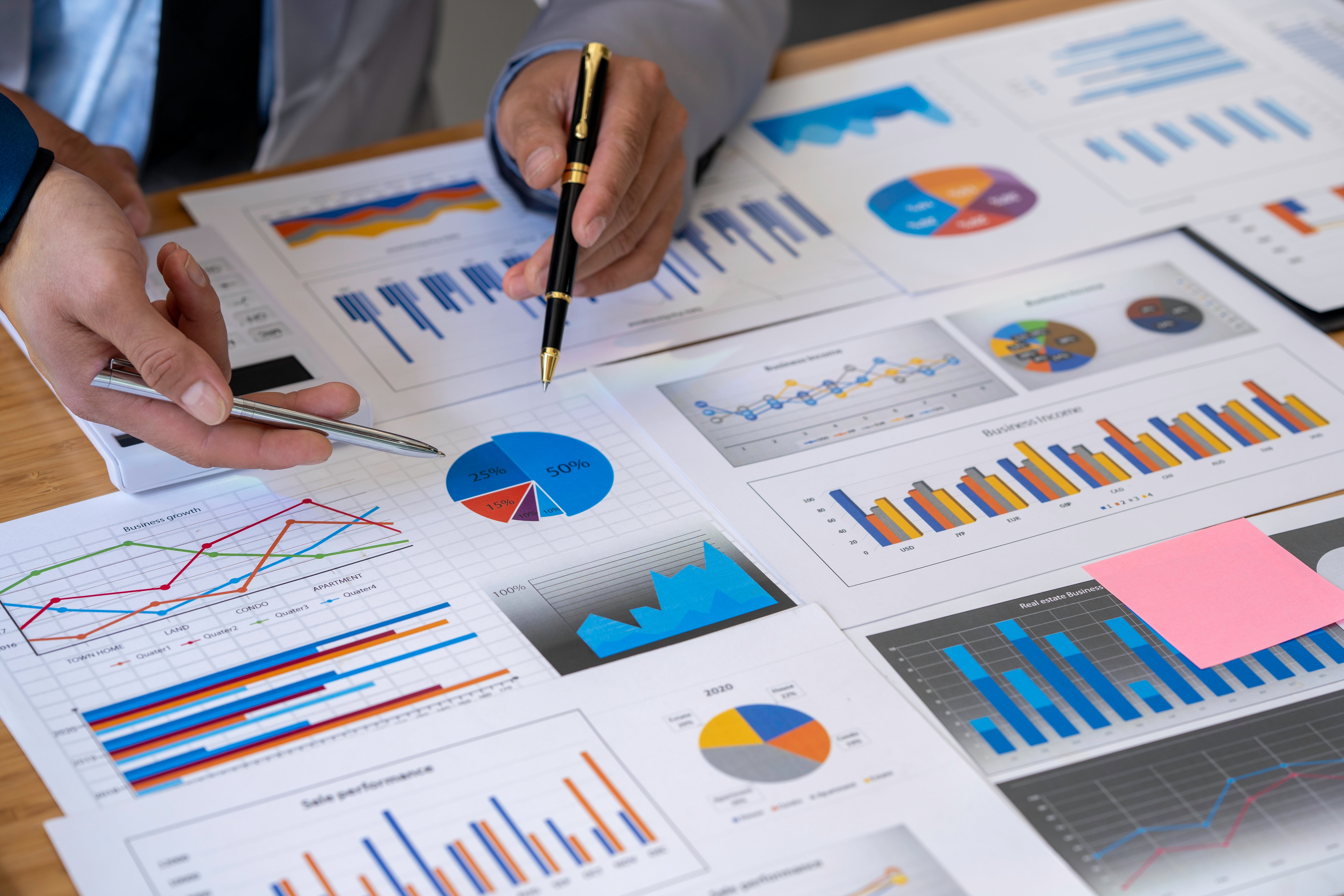 business team analyzing business data charts