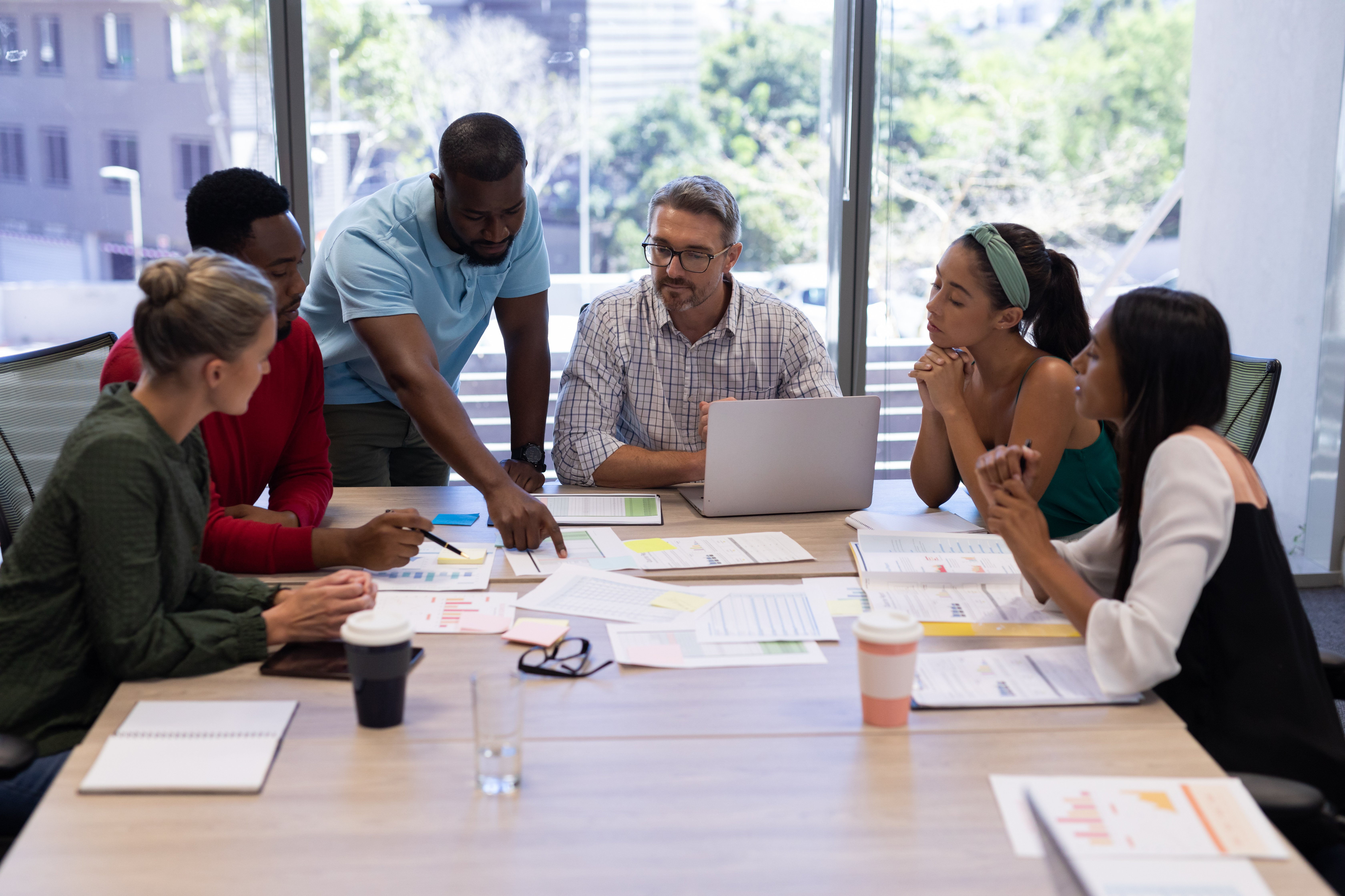 biracial-female-and-male-advisors-discussing-over-2023-11-27-04-49-21-utc