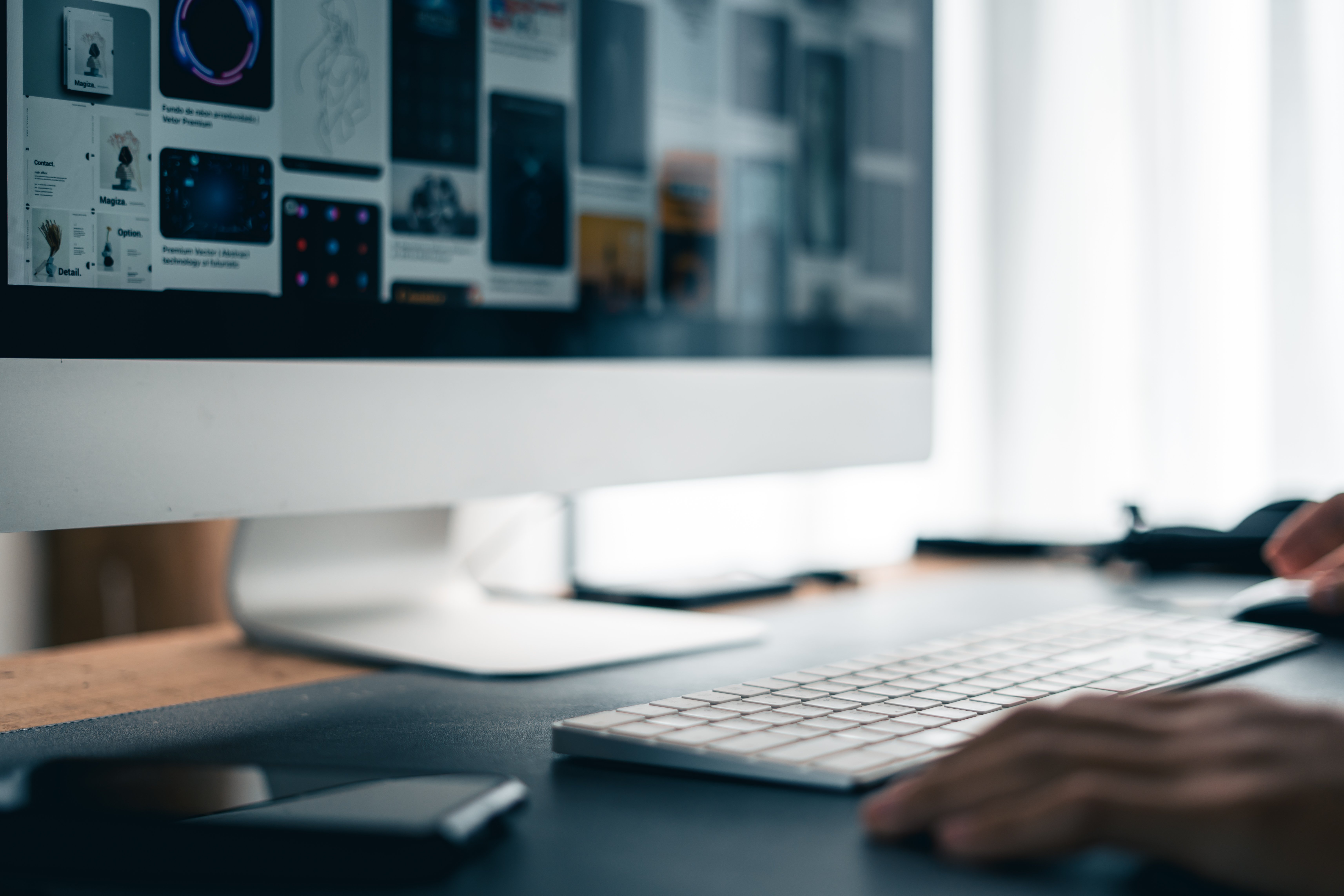 man-working-on-computer-desk-at-home-office-2025-03-13-00-53-17-utc (1)